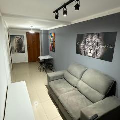 Apto completo a 1 rua da praia com ar condicionado