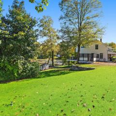 Modern Waterfront Retreat with Hot Tub & Pond Views