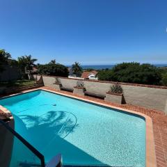 Spacious 4-Bedroom Coastal Haven with Sea Views