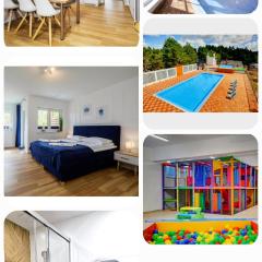 Apartament 11B Niebieskie Apartamenty z basenem krytym, odkrytym, salą zabaw, animacjami