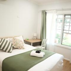 Queen room with shared bathroom