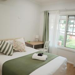 Queen room with shared bathroom