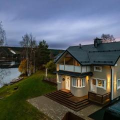 Charming Riverfront Home Just Minutes from Santa Claus Village