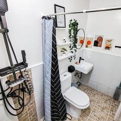 Cozy Three-Bedroom Staycation House with Netflix, Wi-Fi, and Free Parking Garage near SM Caloocan