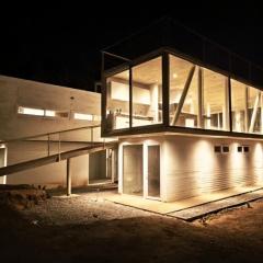 Concrete house overlooking the ocean and beach access