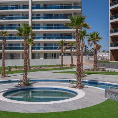 R202: Stylish 1-Bedroom Condo with Private Balcony, King Bedroom, and Relaxing Ocean Views