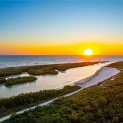 Beachfront condo with year-round sunsets