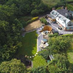 Private lodge spa, sauna, hot tub, outdoor kitchen with firepit area