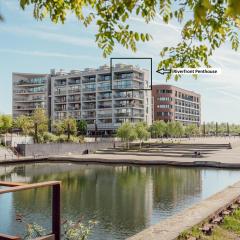 Stylish Riverfront Penthouse with Skyline View
