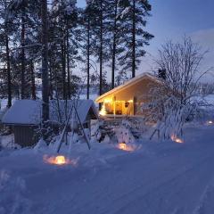 Villa Salme lemmikkiystävällinen mökki Taivalkoskella Jokijärven rannalla