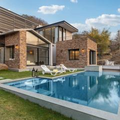 StayVista's Ikebana - Living By The Forest Edge - Mountain-view Villa with Infinity Pool, Lawn, & Indoor-Outdoor Games