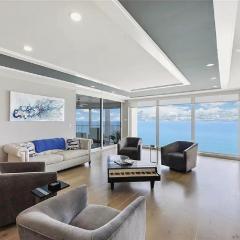 Sophisticated Three-Bedroom Coastal Apartment with Fireplace