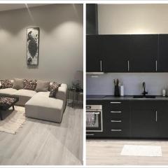 Delikat, romslig og sjønær sentrumsleilighet