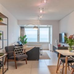 Relax in a cosy apartment with a seaview