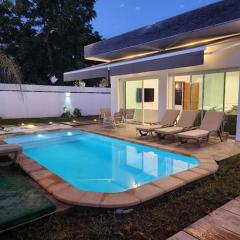 Villa H modern living steps from the beach