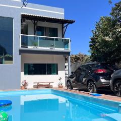 Casa de Verão, 04 quartos, 03 banheiros, piscina e churrasqueira para relaxar