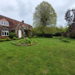 Old school house surrounded by countryside