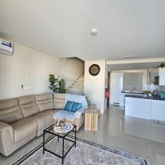 A modern two-story townhouse in Beachfront Sifah