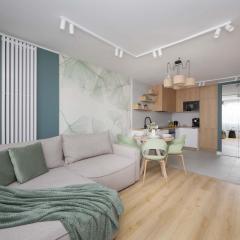 Stylish Apartment with Air Conditioning and a Workspace in the City Center of Warsaw by Noclegi Renters
