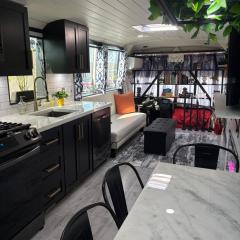 Sleek, Modern, Pet Friendly Custom Tour Bus!