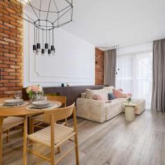 Rakowicka Brick Apartment near Station by Noclegi Renters