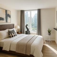 High-Rise 2BR Apartment with City Views and Cozy Interiors