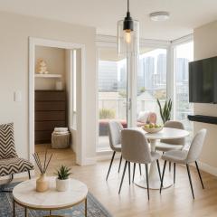 High-Rise 2BR Apartment with City Views and Cozy Interiors