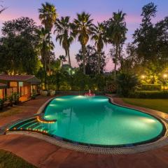 StayVista at The Birdwood Estate with Gym and Pool