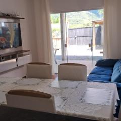 A sua casa de praia dos sonhos espera por você