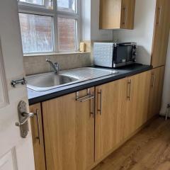 Two Single bedrooms in garden studio with kitchenette and bathroom