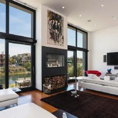 Sleek Four-Bedroom Canal-View Home With Private Loft and Rooftop Terrace