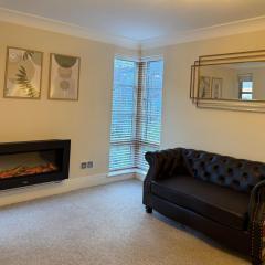 Riverside city-centre apartment with parking