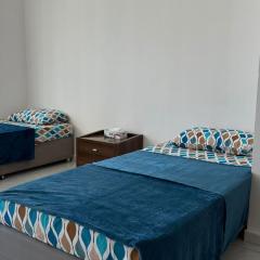 Single bed in al Majaz 2 - سوبر ديلوكس سرير مفرد في شقة فندقية