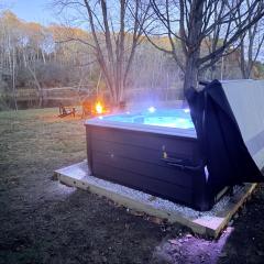 Riverfront Relaxation with Hot Tub, Fire Pit, and Deck