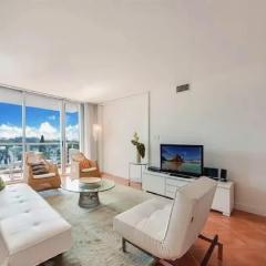 Bright Two-Bedroom Oceanfront Condo With Balcony and Coastal Views