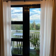 Bright Modern Stay with Balcony & Ocean Breeze