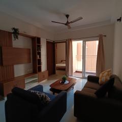 Cozy 1BHK 10 mins from BLR Airport at Prestige Finsbury