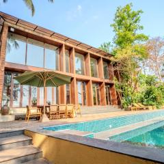 ELIVAAS The Glass Villa - An ultra-luxurious 4-BHK villa with an infinity pool