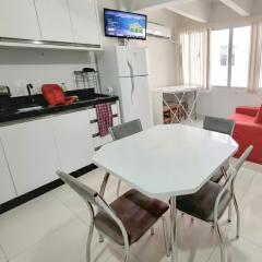 Loft 80 metros do mar na Praia Central com garagem