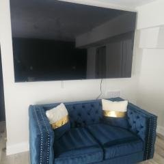 Modern Basement Suite • King Bed & 100” TV