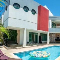 Casa 5 quatos com 4 suites, piscina, condomínio frente mar!