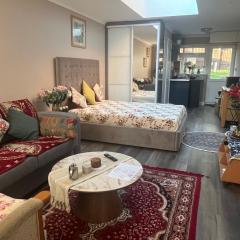 Cosy self-contained extension with skylight & garden view