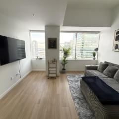 Luxury Downtown One Bedroom with Skyline Views and Free Parking