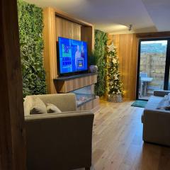 Luxurious riverside lodge with private wood fired hot tub