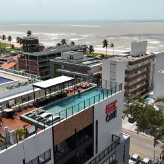 Flats a poucos metros do mar - Get One