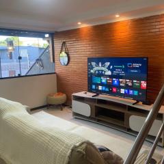 Casa 50 metros da praia,suíte,área gourmet,ambiente climatizado