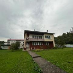 House with mountain views and garden by the stream
