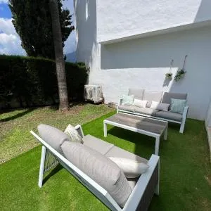 Impeccable large apartment with immense terrace and private garden overlooking the mountain, featuring 2 bedrooms and sleeping up to 4 guests located 100 meters from Plaza Maestranza