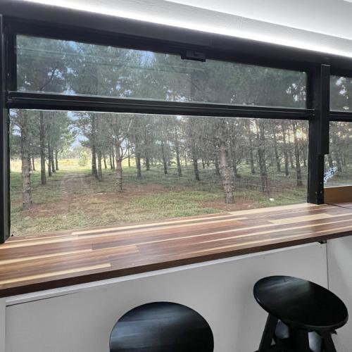 Image of Bussie McBusFace, converted bus in Little River