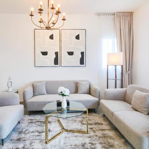 Image of Al Reef 3BR - Chic Poolside Luxe Retreat